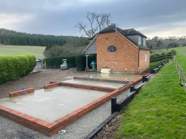 Concrete slab on a brick plinth ready for the oak garage frame