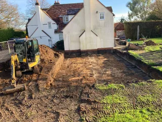 Mini digger excavating the footprint for the Cowfields kitchen extension