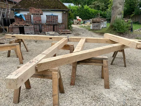 Jointed oak beams for the entrance frame laid out on trestles
