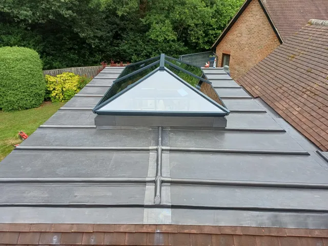 Glazed roof lantern set into the flat roof of the oak garden room